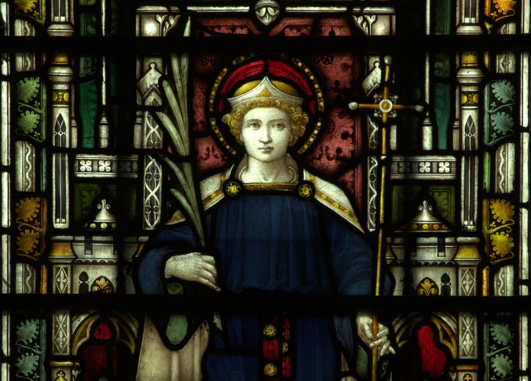 Alban holds a martyr's palm frond in a story window at Truro Cathedral
