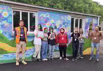 Students creating mural artwork at Fowey Docks in Cornwall