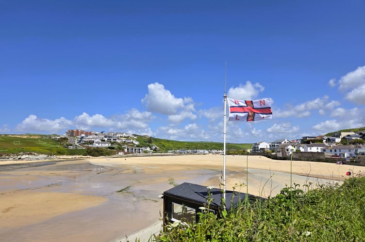 A tranquil Porth beach in the morning sunshine.