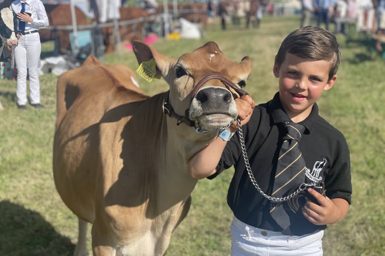 Youngster Joseph Best from Landulph is all smiles at the Liskeard Show 2025