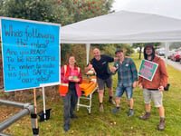 Community unites despite downpour as strike action continues at school