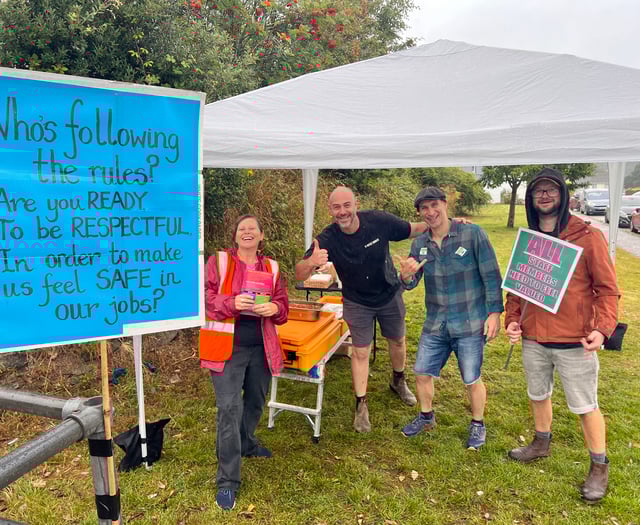Community unites despite downpour as strike action continues at school