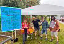 Community unites despite downpour as strike action continues at school