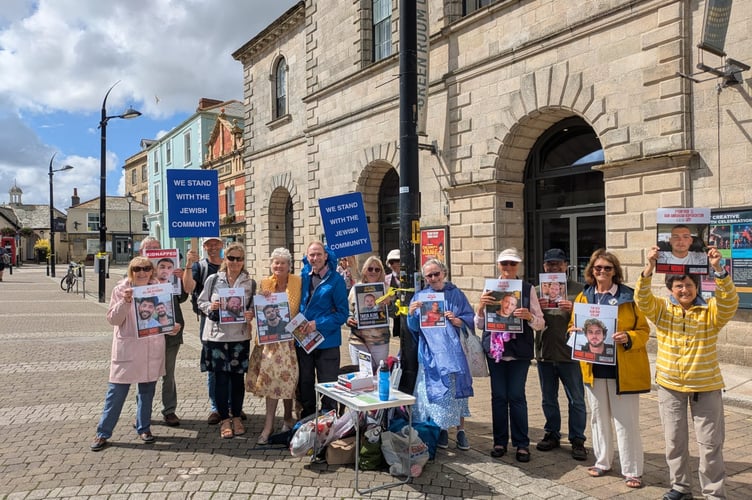 The silent vigil for hostages on Lemon Quay, with Cynthia Hollingsworth (far right)