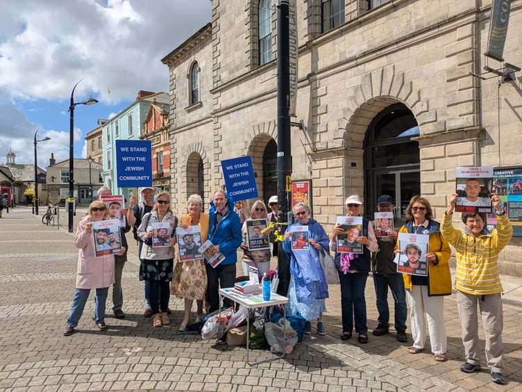 The silent vigil for hostages on Lemon Quay, with Cynthia Hollingsworth (far right)