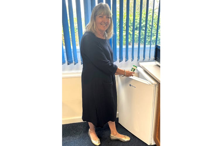 Parish council chair Julie Broad with a Message In a Bottle.