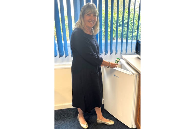 Parish council chair Julie Broad with a Message In a Bottle.