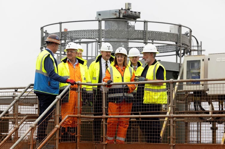The Chancellor observing how contaminated mine water is treated from the top of the water treatment plant.