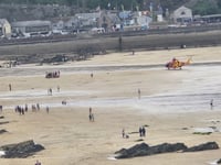 Swimmer rescued after experiencing medical episode