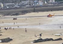 Swimmer rescued after experiencing medical episode