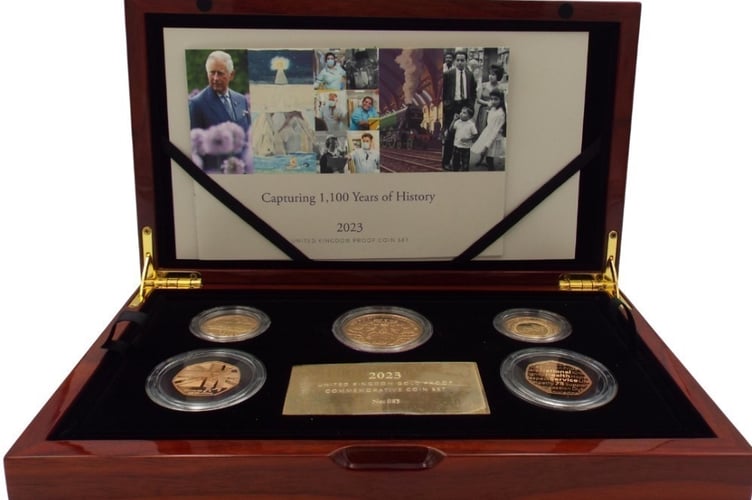A close-up of the limited-edition (number 85 of 150) five-coin set of gold proof commemorative coins dated 2023 which has an estimate of £7,000-£8,000.