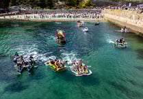 Crowds line shore to watch madcap raft race