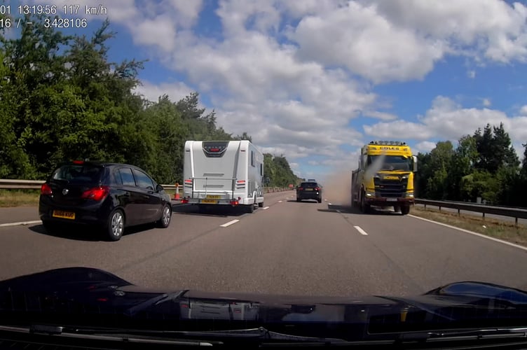A truck smashing through the central reservation on the motorway. This is the hair-raising moment a truck narrowly missed a driver in a £100k Porsche after it careered across a central reservation and sped the wrong way down a busy motorway. Peter Stone, 55, was driving home from a family trip to St Agnes, Cornwall, in his Porsche 911 when a lorry came crashing through the central reservation of the M5 - between Junction 28 and Junction 29, at 12.23pm on Friday, August 1. The dad-of-two - who was travelling northbound in the fast lane - had just seconds to react to avoid what could have been a fatal crash (Picture: Peter Stone / SWNS)