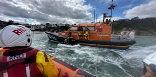 Lifeboats called to rescue pair drifting in inflatable boat off coast