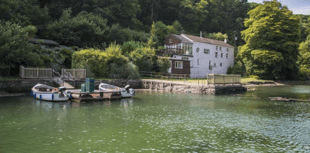 Riverfront estate with rock history and private studio up for sale
