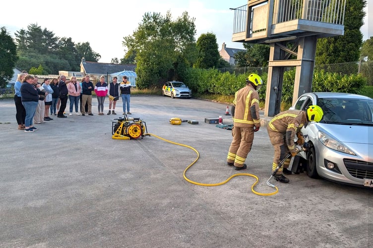 St Dennis firefighters giving a demonstration to members of Roche Young Farmers Club. (Picture: St Dennis Community Fire Station)