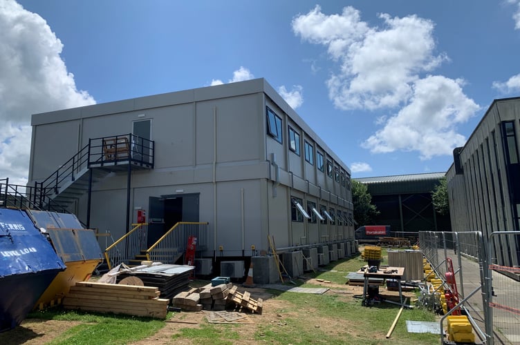 A temporary building has been created to house the Engineering Training School so that training by Merlin Helicopter Force can continue.