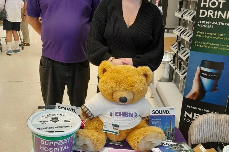 Father and daughter CHBN volunteers Jeff and Clarissa Jacobs at Waitrose with Radio Ted, who is registered with Voluntary Services at the Royal Cornwall Hospital and has his official hospital badge.