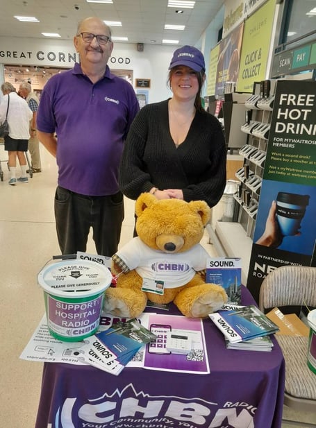 Father and daughter CHBN volunteers Jeff and Clarissa Jacobs at Waitrose with Radio Ted, who is registered with Voluntary Services at the Royal Cornwall Hospital and has his official hospital badge.
