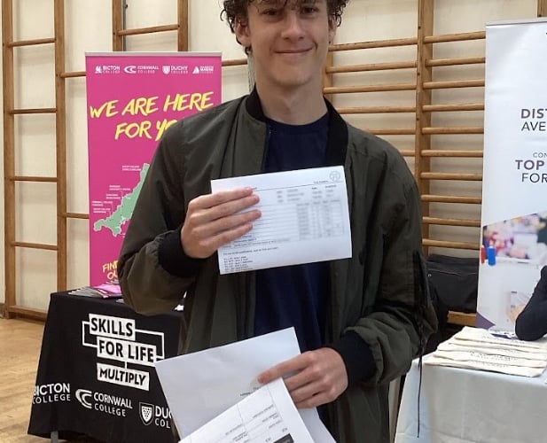 Nikita celebrates his GCSE results at Pool Academy