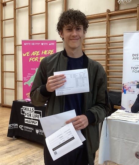 Nikita celebrates his GCSE results at Pool Academy