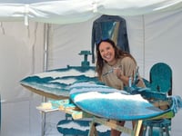 Ocean-infused surfboard artwork auctioned for charity