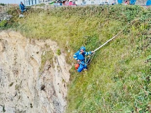 Two people winched to safety after being cut off by Erin swell