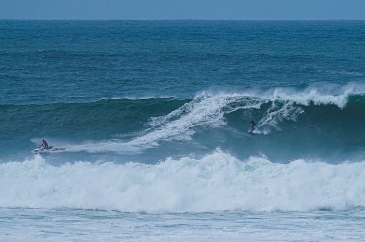Jules Chenoweth onboard a jetski towed Mr Douglas into the Cribbar waves (Picture: Josh Curtis)