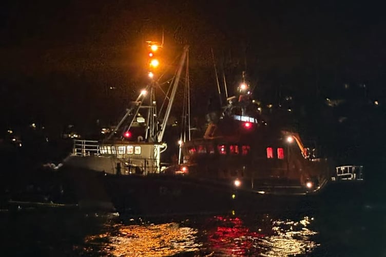 Penlee lifeboat alongside the fishing vessel.