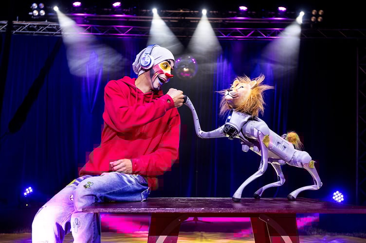 Take a look at the world's first robotic circus lion - which took 11 months to build. Ion the robotic lion has been taking to the stage in Newquay, Cornwall, at Paulo's Circus. Billed "the world's first and only robotic circus lion," Ion is described as "a core part of the show," in an act that sees him jump through hoops and perform tricks. Pictured with co-star Poroto the clown, Ion can be seen doing handstands, posing for selfies, and "showing off" in front of the audience.