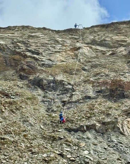 A rope technician was lowered down to the dog (Picture: Newquay Coastguard Search and Rescue Team)