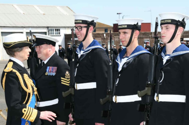 Recruit Joshua Hopson from Torpoint (second left) chats with Her Royal Highness, The Princess Royal, during his passing out parade at HMS Raleigh
