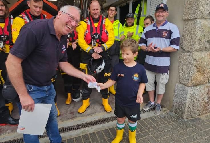 Mr Horner is delighted to receive the cheque from Dylan (Picture: Charlotte Jane)