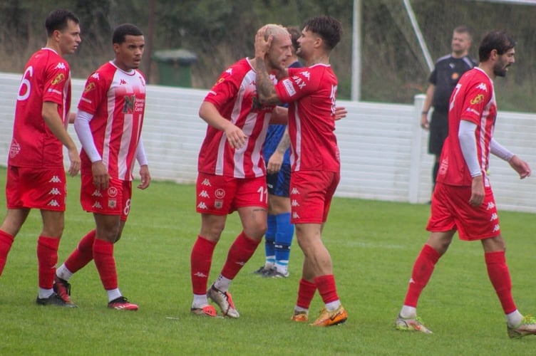 Jack Bray-Evans congratulates Louis Price on one of his two goals. 