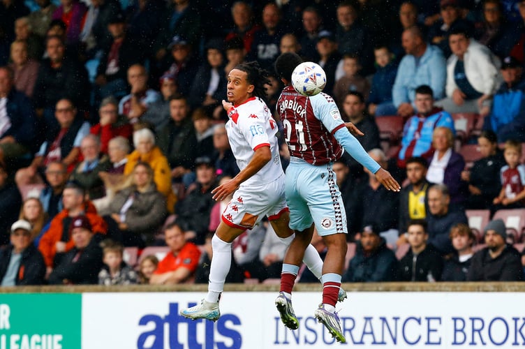 Ben Starkie of Truro City challenges for an aerial ball with Joe Starbuck of Scunthorpe United during the Enterprise National League match between Scunthorpe United and Truro City at The Attis Arena on 20 September 2025 in Scunthorpe, England (Photo by Steve Taylor/PPAUK)