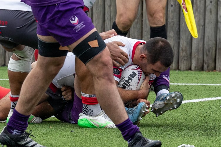 Camborne scrum half CJ Boyce dots down his team's fifth try in the big win at Loughborough - Photo Steve Mock.