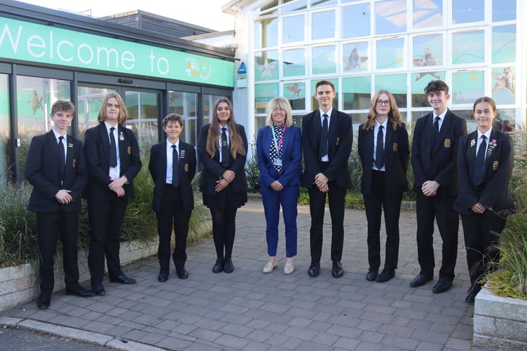 The head and deputy head students with headteacher Tanya Coleman.