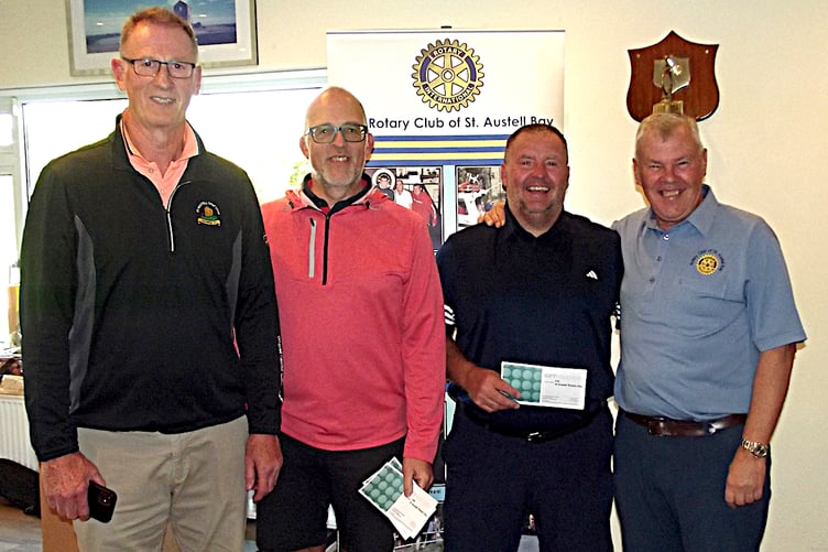 Simon Ferguson-Smith, organiser, with Steve Humphries and Dave Stevens, members of the winning team, and Rotary president Glyn Rowett.