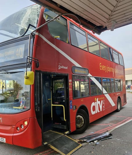 Bus clips Royal Cornwall Hospital canopy