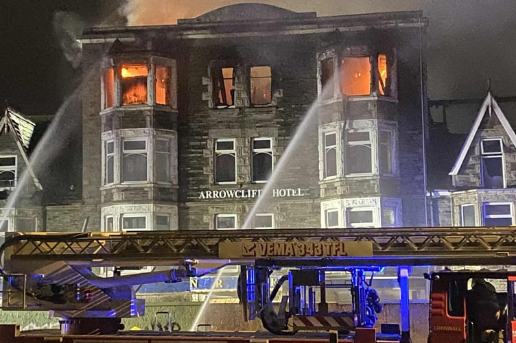 Firefighters battling the blaze at the former Narrowcliff Hotel (Picture: Rhett Imrie)