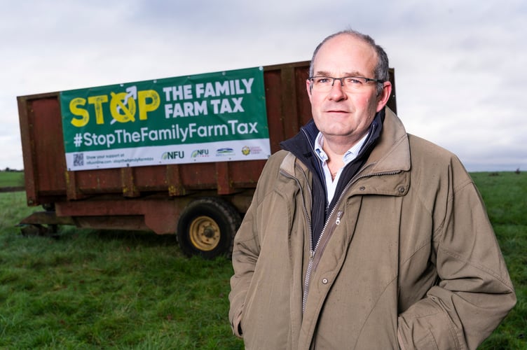 NFU President, Tom Bradshaw, visits the site where one of many Stop the Family Farm Tax field banners have been installed on prominent transport routes. This banner, visible from the M6 motorway, has been put up by Graham Hoggard a Warwickshire based farmer.