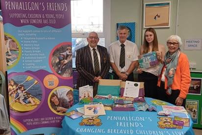 Bolingey Barbarians president Roger Mead, Stephen and Megan Uphill and patron of Penhaligon’s Friends Dame Annette Egerton DBE, with new teen z-card resource.