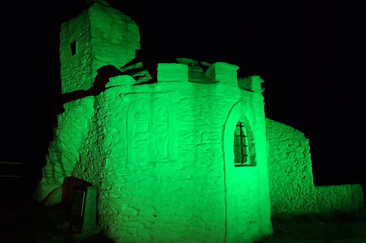 The Huer's Hut was lit up green to highlight mental health awareness week (Picture: Newquay Lions)