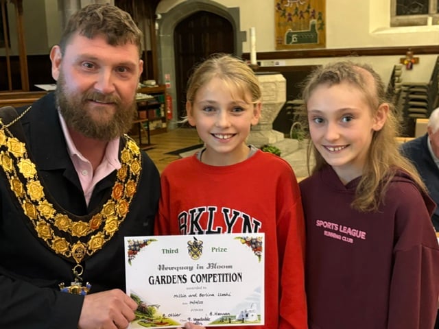 Mille and Berlina Lleshi being presented with their award