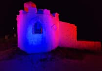 Iconic building illuminated to highlight awareness