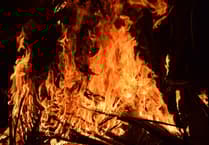 Firefighters tackle out-of-control bonfire at Par that was spreading to a boat