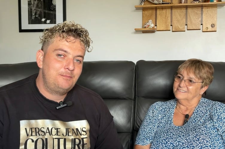Dave in the family home with his mother Jackie.