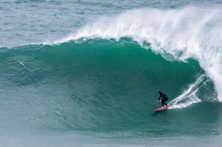 Brave surfers ride the huge walls of water (Pictures: Geoff Tydeman)