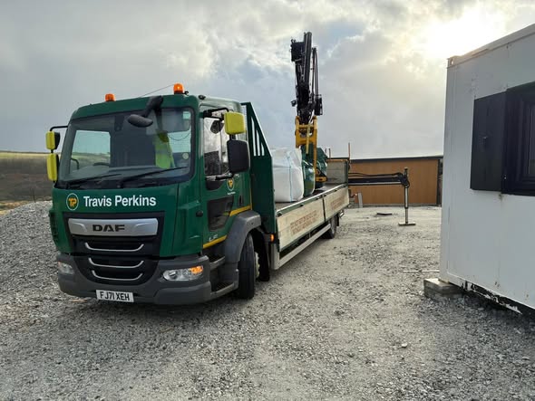 Travis Perkins unloading the donated materials
