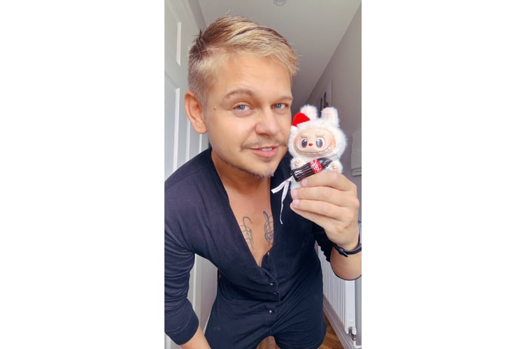 Duane AJ with a Labubu.